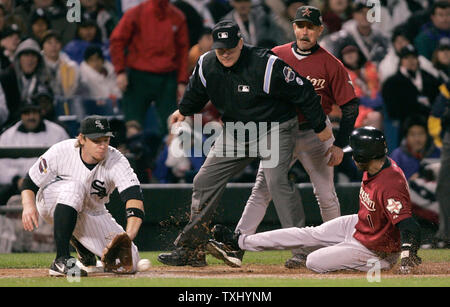 Houston Astros' Willy Taveras, bottom, slides safely into third for a  triple past Cincinnati Reds third baseman Joe Randa during the sixth inning  Friday, April 15, 2005, in Cincinnati. (AP Photo/David Kohl