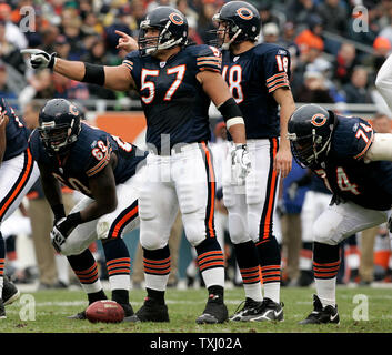 Chicago Bears center Olin Kreutz (57) and teammates Terrence Metcalf, from left, Kyle Orton, and Ruben Brown get ready to run a play against the Carolina Panthers, during the second quarter at Soldier Field, in Chicago on November 20, 2005.  The Bears defeated the Panthers 13-3. (UPI Photo/Brian Kersey) Stock Photo