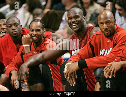 Miami Heat's Dwyane Wade, from left, Derek Anderson, Shaquille O'Neal and Alonzo Mourning sit on the bench late in the fourth quarter of game 6 of the first round of the NBA playoffs in Chicago on May 4, 2006. The Heat won 113-96. (UPI Photo/Brian Kersey) Stock Photo