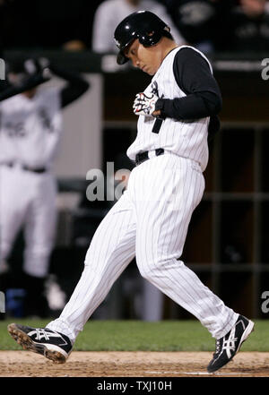 Chicago White Sox's Tadahito Iguchi, of Japan, scores on Paul Konerko's sacrifice fly during the fifth inning against the Oakland Athletics at U.S. Cellular Field in Chicago, on May 22, 2006. (UPI Photo/Brian Kersey) Stock Photo