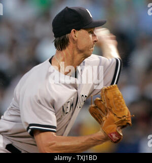 New York Yankees Randy Johnson and Jorge Posada talk on the mound after a 3  run homer by Tampa Bay Devil Rays Damon Hollins in the third inning at  Yankees Stadium in