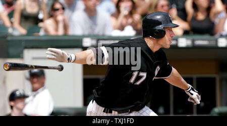 Chicago White Sox's Joe Crede, left, gets a cleat to the neck as Baltimore  Orioles' Miguel Tejada completes a double play that caught Crede and Ross  Gload out in the fifth inning