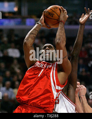 Houston Rockets' Tracy McGrady (1) goes up for a shot as Chicago Bulls' Luol Deng, of Sudan, defends during the first quarter in Chicago on January 8, 2007. The Rockets won 84-77.  (UPI Photo/Brian Kersey) Stock Photo