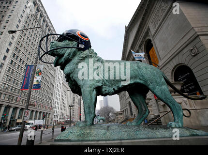 One of the two bronze lions wears a fiberglass Chicago Bears helmet at The Art Institute of Chicago on February 2, 2007, in Chicago. The lions were fitted with fiberglass helmets to celebrate the Bears winning season. The Bears play the Indianapolis Colts in Super Bowl XLI on Sunday. (UPI Photo/Brian Kersey) Stock Photo