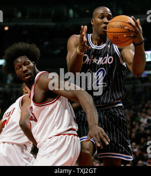 Orlando Magic's Dwight Howard (12) drives to the basket as Chicago Bulls' Ben Wallace (3)defends during the first quarter in Chicago on February 26, 2007. (UPI Photo/Brian Kersey) Stock Photo