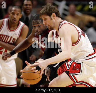 Miami Heat's Dwyane Wade (L) tries to steal the ball from Chicago Bulls' Andres Nocioni (R) of Argentina during the second quarter of Game 2 of the first round of the NBA Eastern Conference quarterfinals in Chicago on April 24, 2007. (UPI Photo/Brian Kersey) Stock Photo