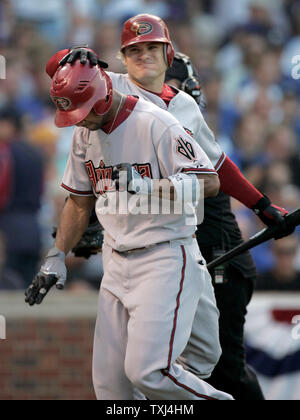 Arizona Diamondbacks center fielder Chris Young, left,  is congratulated by shortstop Stephen Drew after crossing home plate with a solo home run off of Chicago Cubs starting pitcher Rich Hill on the first pitch of the game to begin game 3 of the NLDS at Wrigley Field in Chicago October 6, 2007. (UPI Photo/Mark Cowan) Stock Photo