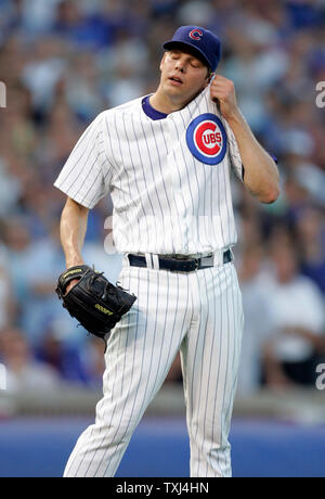 Chicago Cubs starting pitcher Rich Hill wipes his face after giving up a solo home run on his first pitch against the Arizona Diamondbacks at the start of game 3 of the NLDS at Wrigley Field in Chicago October 6, 2007. (UPI Photo/Mark Cowan) Stock Photo