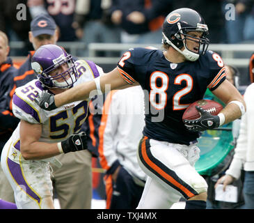 Chicago Bears tight end Greg Olsen (82) is taken down by New Orleans Saints  cornerback Usama Young after a 12-yard reception during the third quarter  at Soldier Field in Chicago on December