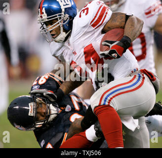 New York Giants' quarterback Eli Manning (10) fumbles the ball as he tries  to pass during the second quarter at Soldier Field in Chicago on December  2, 2007. The Bears recovered the