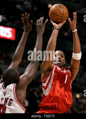 Houston Rockets' Tracy McGrady (1) goes up for a shot as Chicago Bulls' Luol Deng of Sudan defends during the third quarter in Chicago on December 22, 2007. The Rockets won 116-98.  (UPI Photo/Brian Kersey) Stock Photo