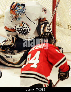 Edmonton Oilers goalie Mathieu Garon gets run into by Columbus Blue  Jackets' Rick Nash during the shoot out in NHL hockey action in Edmonton on  Sunday March 2, 2008. Edmonton beat Columbus