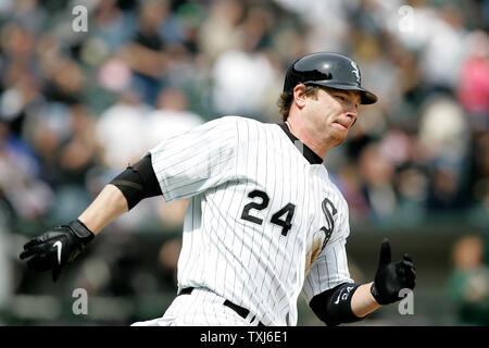 Chicago White Sox Joe Crede follows through on a RBI single scoring Aaron  Rowand against the Houston Astros during the second inning of game 2 of the  World Series at U. S.