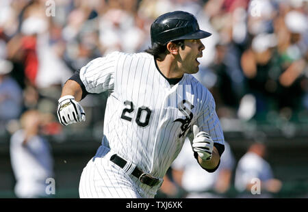 Chicago White Sox's Alexei Ramirez rounds the bases after hitting a  three-run homer scoring Ken Griffey Jr. and Paul Konerko during the first  inning against the Seattle Mariners on August 20, 2008