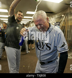Tampa Bay Rays relief pitcher Jason Hammel (L) pours champagne on manager Joe Maddon as they celebrate in the locker room after beating the Chicago White Sox 6-2 in game 4 of the 2008 American League Division Series at U.S. Cellular Field in Chicago, on October 6, 2008. The Rays won the series 3 games to 1. (UPI Photo/Brian Kersey) Stock Photo