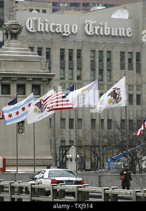 Flags wave on the Michigan Avenue bridge in front of the Tribune Tower on December 8, 2008 in Chicago. The Tribune Company, which owns the Chicago Cubs baseball franchise, as well as the Los Angeles Times, Chicago Tribune, The Sun of Baltimore, The Hartford (Conn.) Courant, six other daily newspapers and 23 television stations, filed for bankruptcy protection Monday in a Delaware court.  (UPI Photo/Brian Kersey) Stock Photo