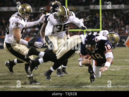 Chicago Bears tight end Greg Olsen (82) is taken down by New Orleans Saints  cornerback Usama Young after a 12-yard reception during the third quarter  at Soldier Field in Chicago on December