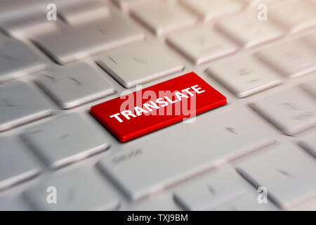 translate button on computer keyboard, translation of languages. blurred in motion background. Stock Photo