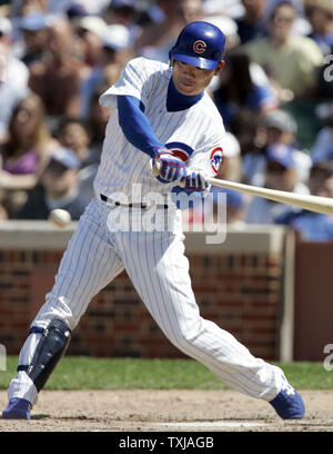 Chicago Cubs left fielder Kosuke Fukudome, from Japan, singles into center field off of San Diego Padres relief pitcher Duaner Sanchez in the sixth inning at Wrigley Field in Chicago on May 14, 2009. (UPI Photo/Mark Cowan) Stock Photo