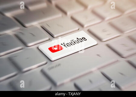 3 June 2018. Barnaul city. Russia. The white button with the company logo youtube on the grey keyboard of a modern laptop. Stock Photo