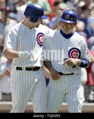 Chicago Cubs' Alfonso Soriano, right, celebrates with Kosuke Fukudome of  Japan, after the Cubs beat the