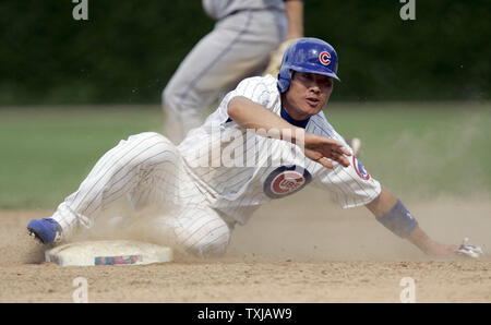Chicago Cubs center fielder Kosuke Fukudome, from Japan, steals second base against the Cleveland Indians in the 13th inning at Wrigley Field in Chicago on June 20, 2009. The Cubs defeated the Indians 6-5 in 13 innings. (UPI Photo/Mark Cowan) Stock Photo
