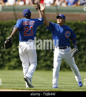 Chicago Cubs right fielder Milton Bradley and center fielder Kosuke Fukudome celebrate their win over the Houston Astros at Wrigley Field in Chicago on July 29, 2009. The Cubs won 12-0.     UPI/Brian Kersey Stock Photo