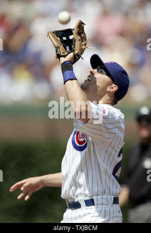 Chicago Cubs second baseman Jeff Baker fields a pop-up by Philadelphia Phillies left fielder Ben Francisco in the second inning at Wrigley Field in Chicago on August 13, 2009. UPI /Mark Cowan Stock Photo