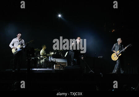 The Edge (from left), Larry Mullen Jr., Bono and Adam Clayton of U2 perform the first concert of their 360 Degree North American Tour at Soldier Field in Chicago on September 12, 2009.     UPI/Brian Kersey Stock Photo