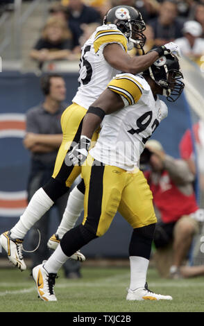 Pittsburgh Steelers free safety Ryan Clark (25) congratulates linebacker James Harrison (92) after tackling Chicago Bears running back Matt Forte (22) during the second quarter at Soldier Field in Chicago on September 20, 2009. UPI /Mark Cowan Stock Photo