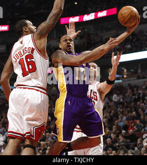 Los Angeles Lakers guard Shannon Brown (C) goes up for a shot as Chicago Bulls forward James Johnson and center Brad Miller defend during the second quarter at the United Center in Chicago on December 15, 2009.    UPI/Brian Kersey Stock Photo