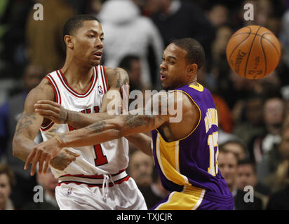 Chicago Bulls guard Derrick Rose passes the ball around Los Angeles Lakers guard Shannon Brown during the second quarter at the United Center in Chicago on December 15, 2009. The Lakers won 96-87.    UPI/Brian Kersey Stock Photo