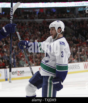 Vancouver Canucks defenseman Kevin Bieksa (3) and Los Angeles Kings ...