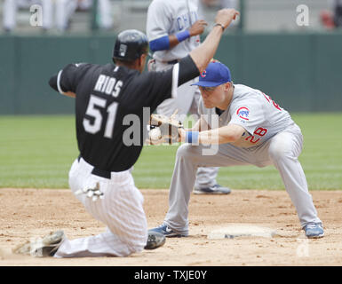 Chicago Cubs second baseman Jeff Baker catches Chicago White Sox's Alex Rios stealing during the third inning at U.S. Cellular Field in Chicago on June 27, 2010.   UPI/Brian Kersey Stock Photo