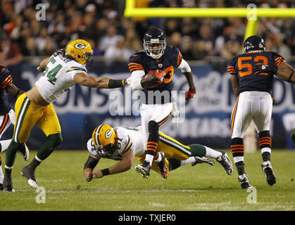 Chicago Bears kick returner Devin Hester (23) breaks Minnesota Vikings  Heath Farwell's (59) tackle on his way to an 89-yard punt return for a  touchdown during the first quarter at Soldier Field