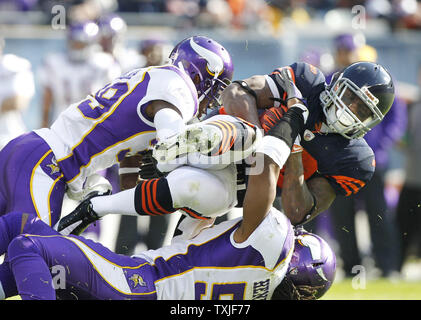 Seattle Seahawks linebackers Heath Farwell (55) and Korey Toomer (59)  tackle Chicago Bears wide receiver Alshon Jeffery (17) in the fourth  quarter of a pre-season game at CenturyLink Field in Seattle, Washington