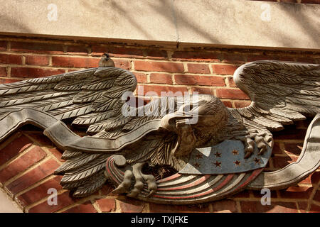 U.S. national symbols decorating building in Downtown Philadelphia, PA  USA. Sparrow and nest on the sculpted motif. Stock Photo