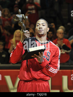 Chicago Bulls guard Derrick Rose holds up the Maurice Podoloff Trophy after being named the NBA MVP at a ceremony before game 2 of the NBA Eastern Conference Semifinals against the Atlanta Hawks at the United Center in Chicago on May 4, 2011. Rose was named MVP Monday.     UPI/Brian Kersey Stock Photo