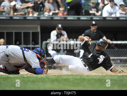 Chicago White Sox's Juan Pierre (R) scores on a sacrifice fly hit by Paul Konerko as Los Angeles Dodgers catcher Rod Barajas applies a late tag during the fourth inning at U.S. Cellular Field in Chicago on May 22, 2011.     UPI/Brian Kersey Stock Photo
