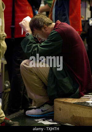 A trader finishes his trades for the day after the market close in the S&P 500 stock index options pit at the Chicago Board Options Exchange on August 8, 2011 in Chicago. The S&P 500 closed at 1,119.46, down 79 points or 6.7 percent, and the Dow Jones industrials closed at 10,809, down 634 points or 5.5 percent, its biggest one-day point drop since December 2008.     UPI/Brian Kersey Stock Photo