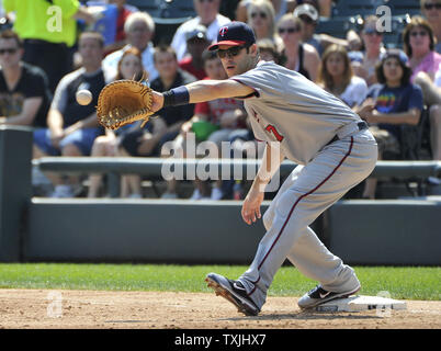 Minnesota Twins first baseman Joe Mauer catches the throw from third base to retire Chicago White Sox's Gordon Beckham during the third inning at U.S. Cellular Field on August 31, 2011 in Chicago. The Twins won 7-6.     UPI/Brian Kersey Stock Photo