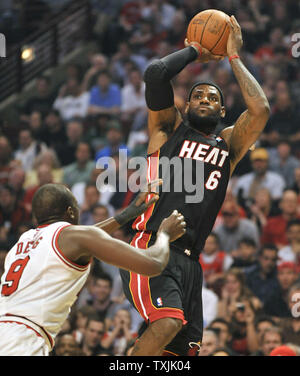 Chicago Bulls' Luol Deng, of Sudan, takes a hard foul from the Detroit ...