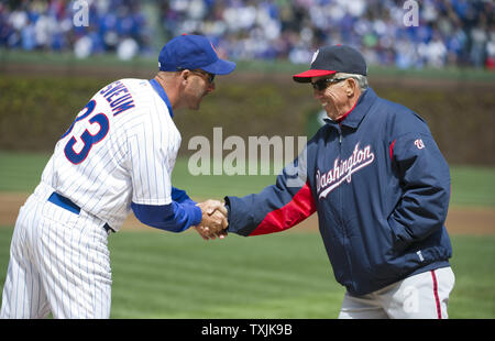 Chicago Cubs manager Dale Sveum (L) shakes hands with Washington Nationals manager Davey Johnson before their opening day game on April 4, 2012 in Chicago.     UPI/Brian Kersey Stock Photo