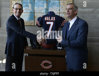 The Chicago Bears new head coach Marc Trestman (L) shakes hands with General Manager Phil Emery during a photo op after a news conference at Halas Hall in Lake Forest, Illinois on January 17, 2013. Trestman was  head coach of the Montreal Alouettes of the Canadian Football League for the past five seasons and was a quarterbacks coach and offensive coordinator for numerous NFL teams before joining the Bears.    UPI/Brian Kersey Stock Photo