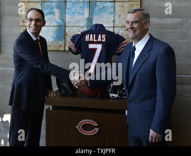 The Chicago Bears new head coach Marc Trestman (L) shakes hands with General Manager Phil Emery during a photo op after a news conference at Halas Hall in Lake Forest, Illinois on January 17, 2013. Trestman was  head coach of the Montreal Alouettes of the Canadian Football League for the past five seasons and was a quarterbacks coach and offensive coordinator for numerous NFL teams before joining the Bears.    UPI/Brian Kersey Stock Photo