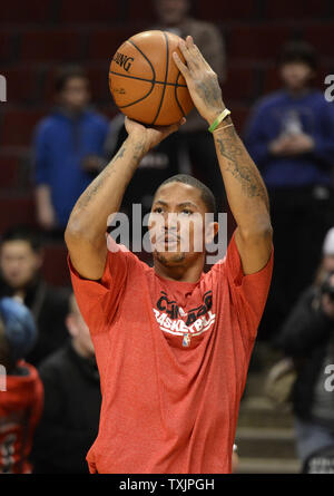 Chicago Bulls Derrick Rose takes a jump shot for two points in front of Minnesota Timberwolves Anthony Bennett in the second quarter at the Scottrade Center in St. Louis on October24 2014