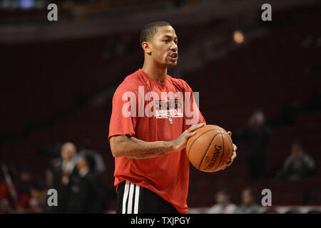 Chicago Bulls Derrick Rose takes a jump shot for two points in front of Minnesota Timberwolves Anthony Bennett in the second quarter at the Scottrade Center in St. Louis on October24 2014