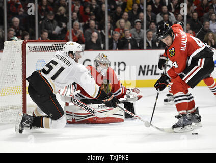 Anaheim Ducks right wing Kyle Palmieri (L) tries to score as Chicago Blackhawks goalie Corey Crawford (C) and defenseman Niklas Hjalmarsson defend during the second period at the United Center in Chicago on February 12, 2013.     UPI/Brian Kersey Stock Photo