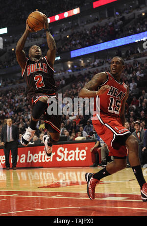 Chicago Bulls point guard Nate Robinson (2) is defended by Miami Heat point guard Mario Chalmers (15) during the first half at the United Center in Chicago on February 21, 2013.     UPI/David Banks Stock Photo