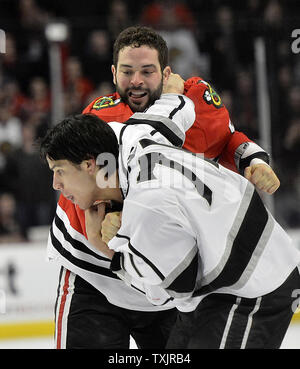 Chicago Blackhawks left wing Brandon Bollig (52) and Los Angeles Kings left  wing Dwight King (74) fight during the first period in Game 7 of the  Western Conference finals in the NHL